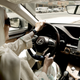 In a June 24th, 2018 photo, Riyadh woman Ammal Farahat drives for Careem.